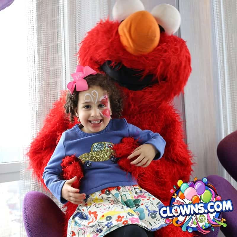Elmo mascot with a kid
