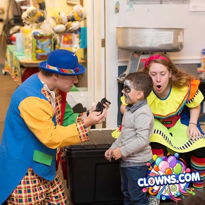 Clowns performing magic tricks