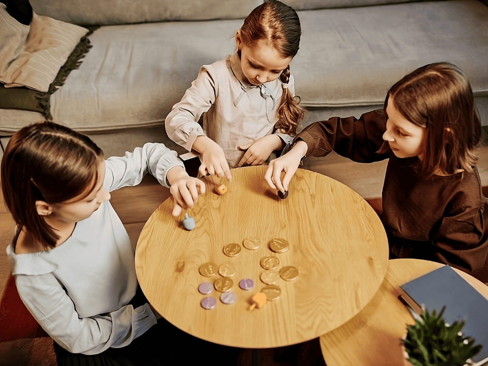 Kids playing with dreidels