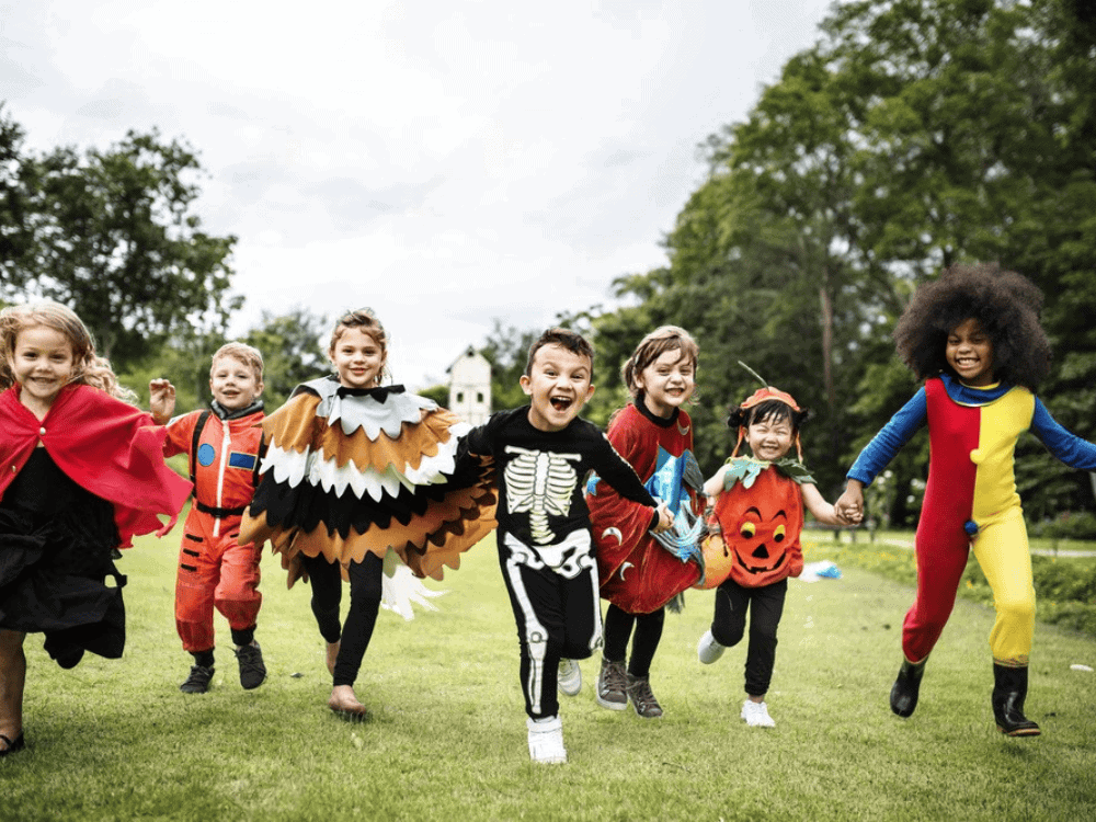 Group of kids running in costumes
