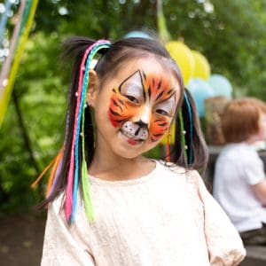 Kid with tiger face paint
