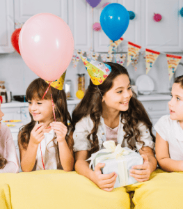 Kids with balloons and gifts